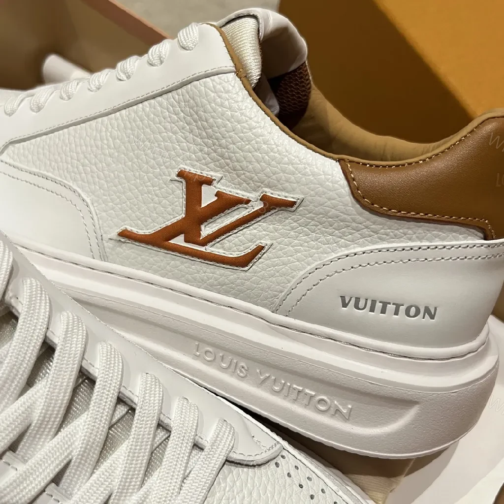View 3 of White Leather Low-Top Sneakers - Contrasting Tan Accents & LV-Inspired Details