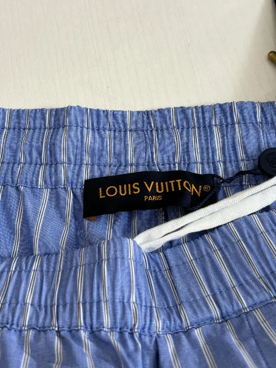 View 3 of Blue Striped Lightweight Drawstring Shorts - Subtle Embossed Logo Luxury