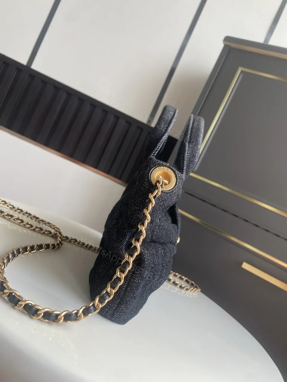 View 2 of Chic Black Denim Mini Bag with Gold Emblem