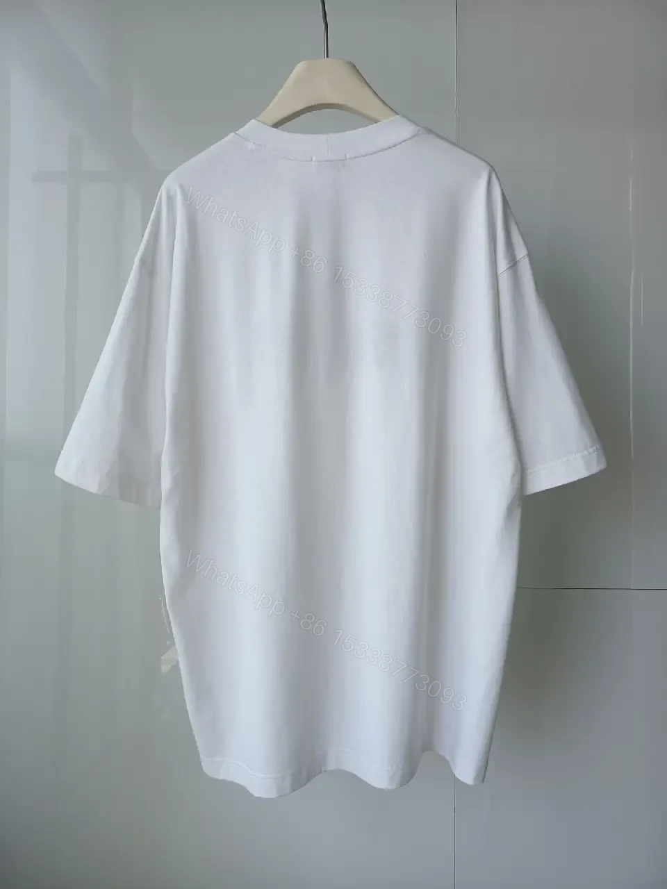 View 4 of Minimalist White Cotton Tee - Relaxed Luxe Comfort