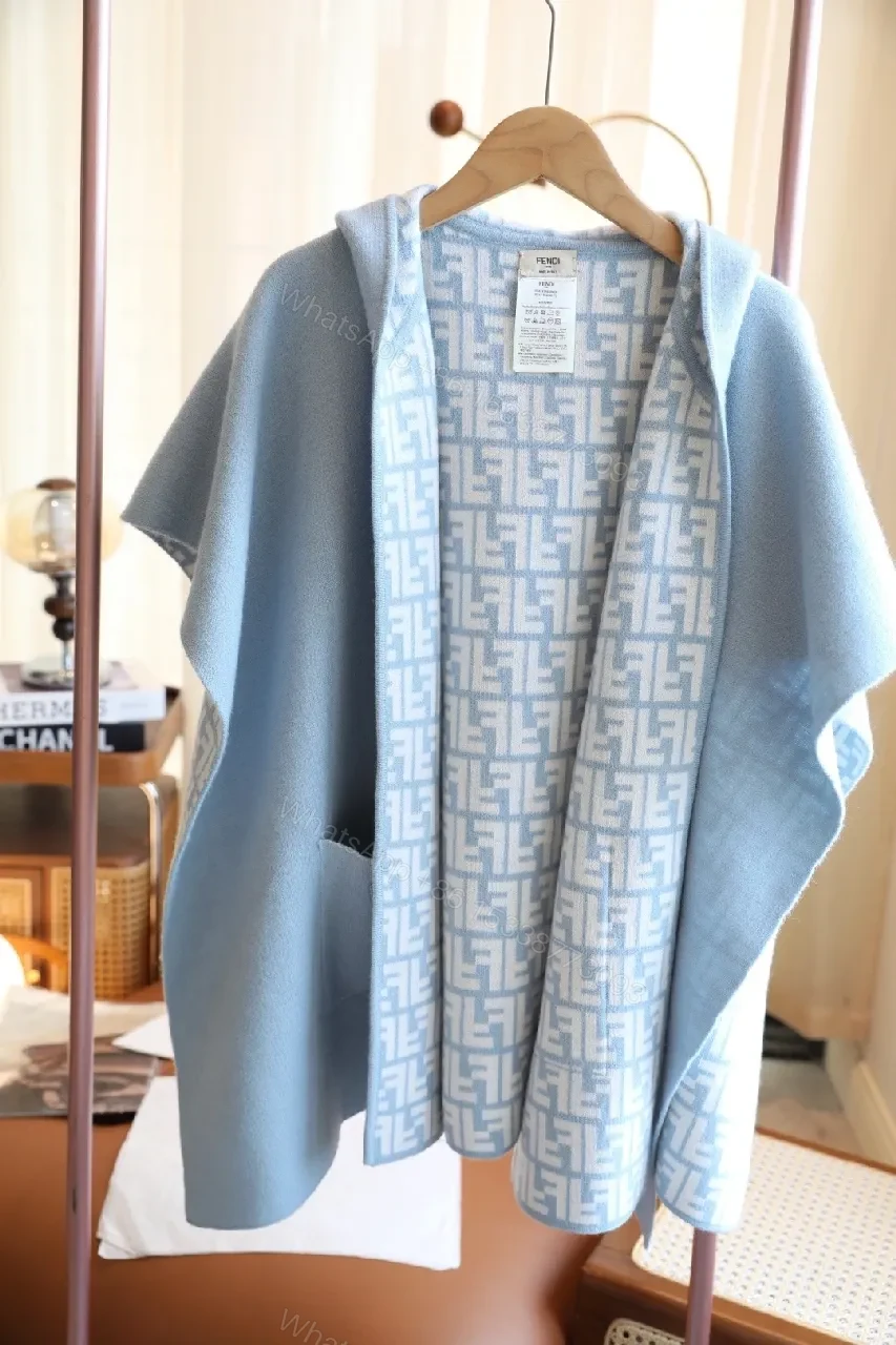 Blue Knit Wrap Coat with Patterned Lining, Luxurious Cozy Style — view 1