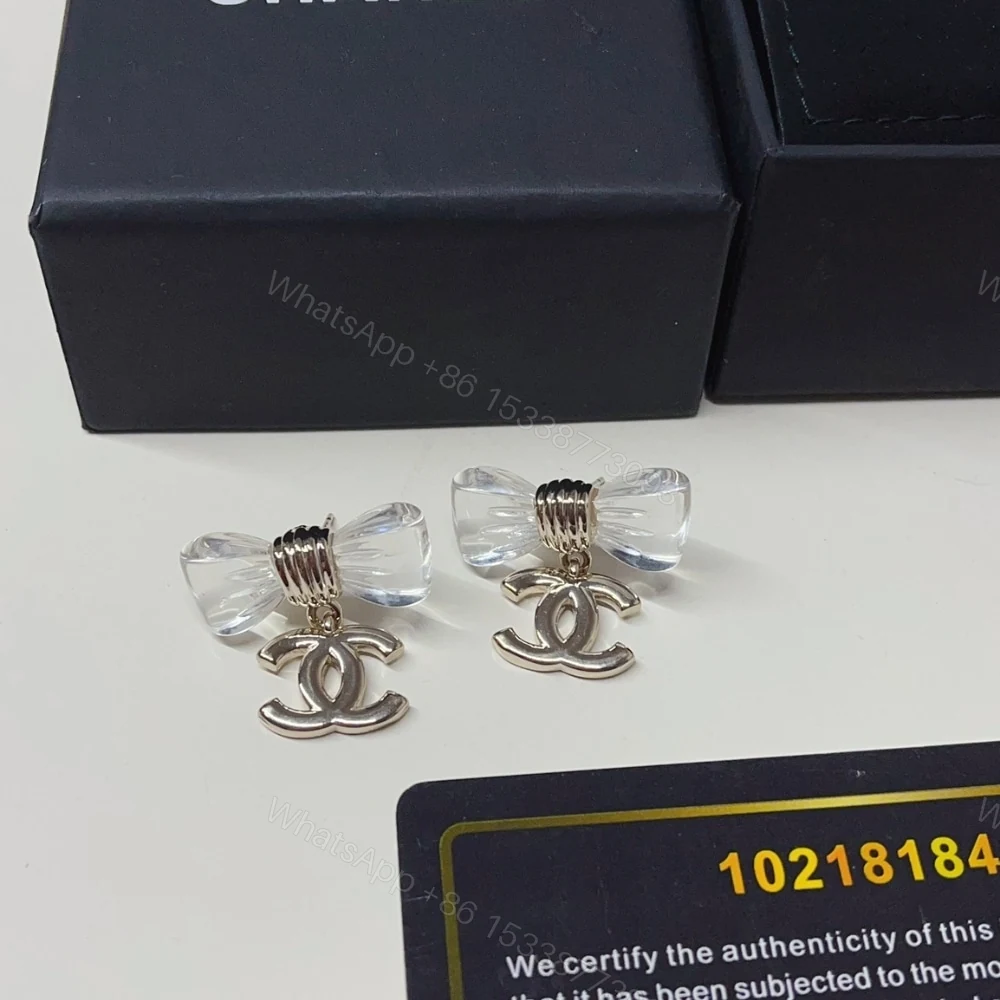View 9 of CHANEL D25 CC BOW EARRINGS GOLD METAL ABF537 B19997 NAFVG