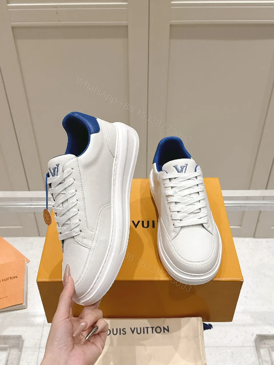 View 9 of Clean White Leather Low-Top Sneakers with Subtle Designer Embellishments