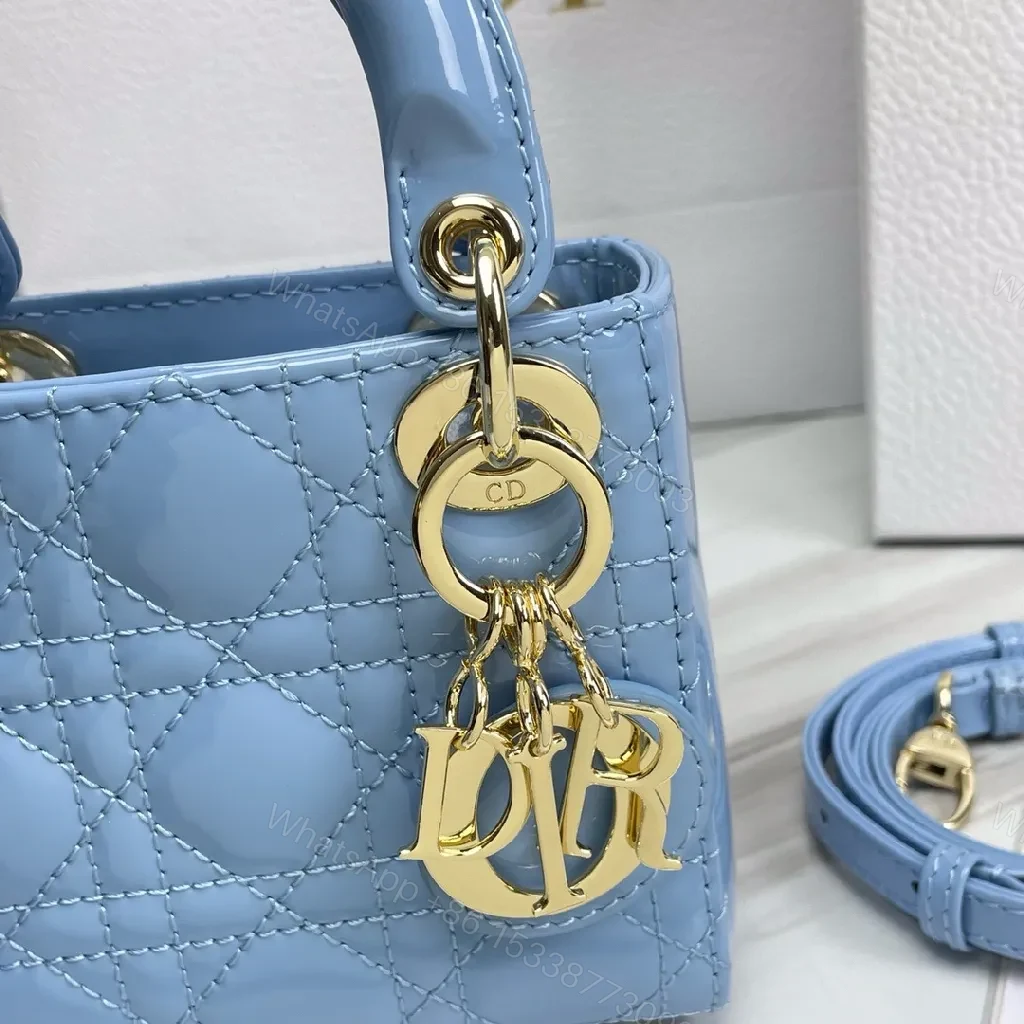 View 5 of Blue Quilted Mini Bag - Calf Leather, Crossbody/Top Handle, Magnetic Closure