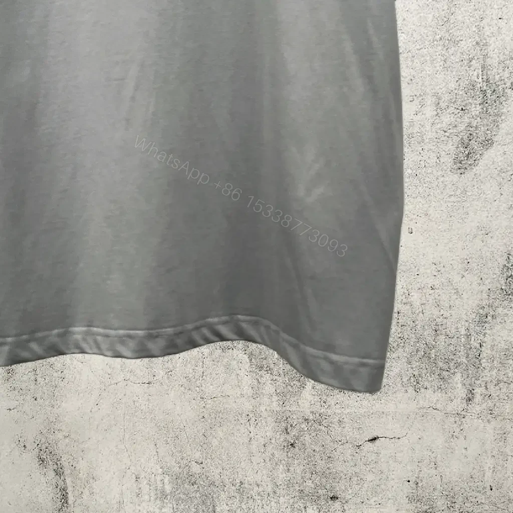 View 2 of Neutral Cotton Oversized Tee: Minimal Logo, Elevated Comfort