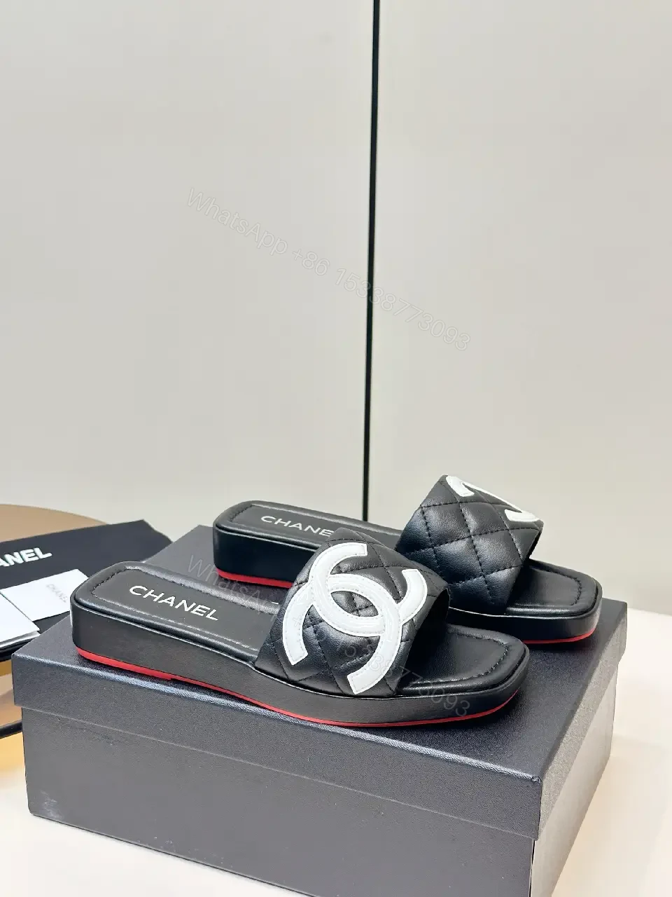 View 6 of Black Quilted Chanel Sliders with White Logo, Slide Sandals