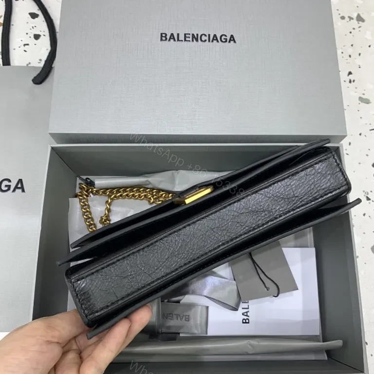 View 7 of Chic Black Leather Mini Bag with Gold B Clasp â€“ Compact Luxury