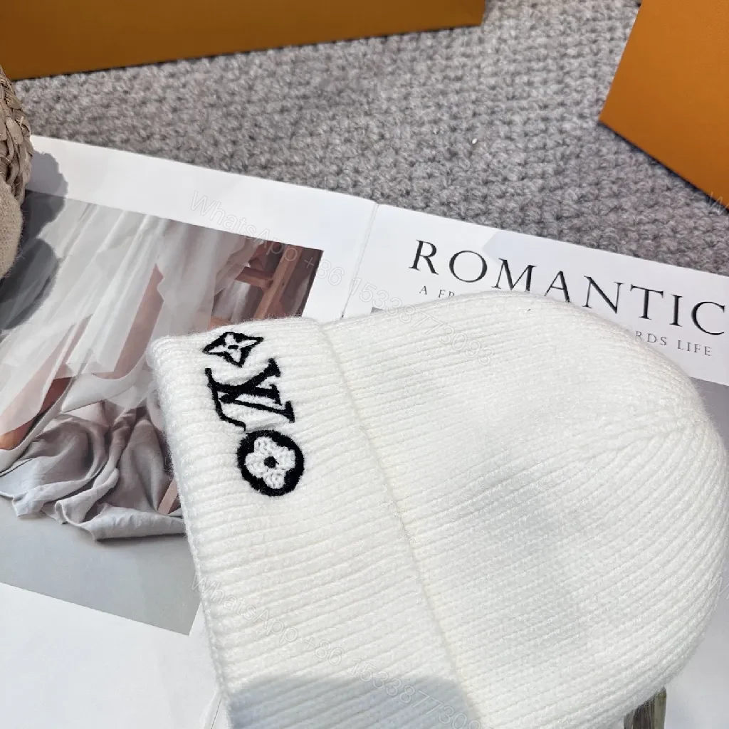 View 3 of White Knit Beanie – Luxe Logo Detail, All-Season Comfort