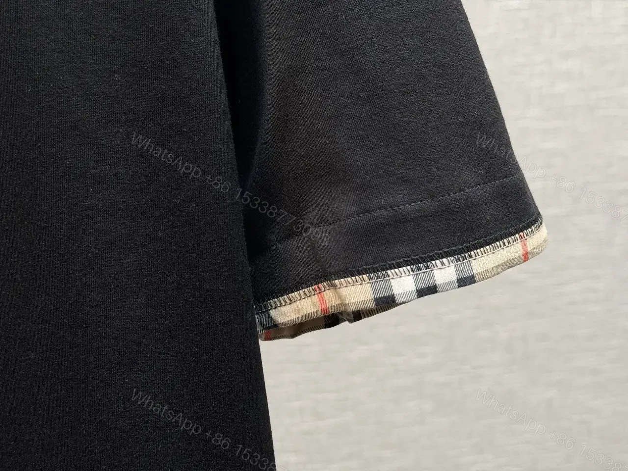 View 4 of Minimalist Black Cotton Tee with Plaid Sleeve Trim
