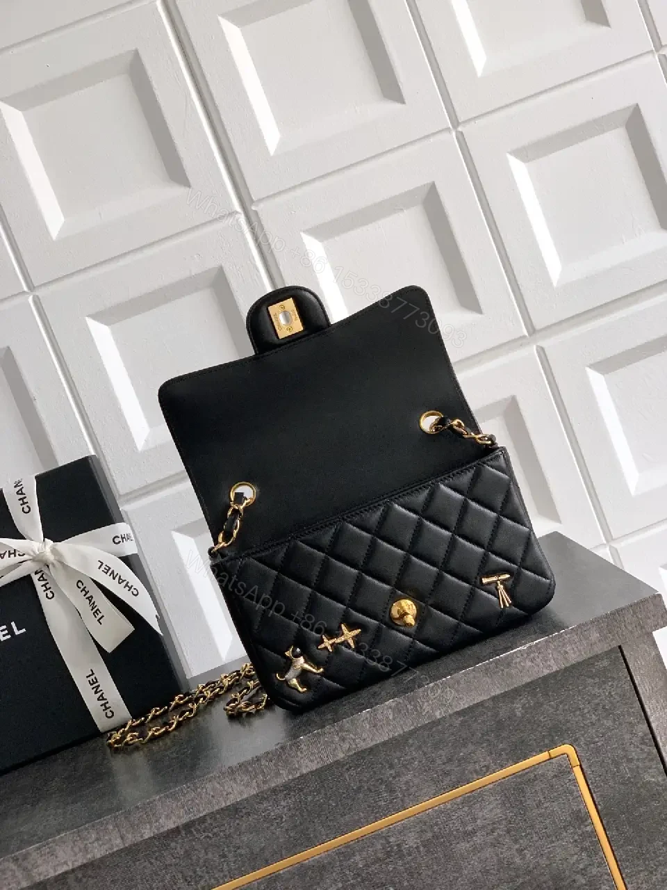 View 2 of Quilted Black Leather Crossbody: Golden Turn-Lock Charm Bag