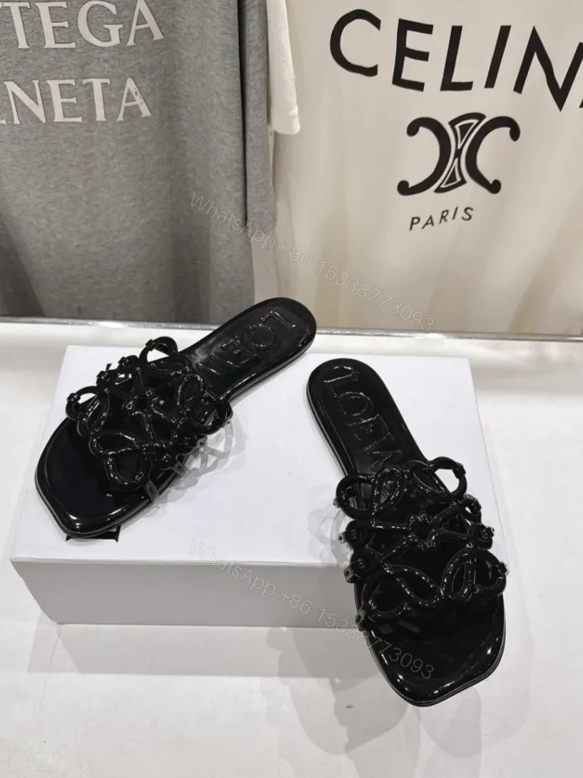 View 4 of Loewe Leather Petal Anagram Slides in Black