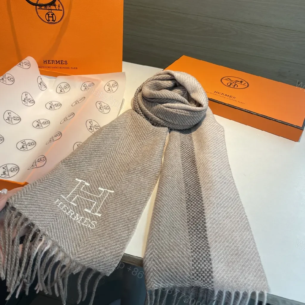 Neutral Herringbone Knit Scarf with Subtle Emblem Detail — view 1
