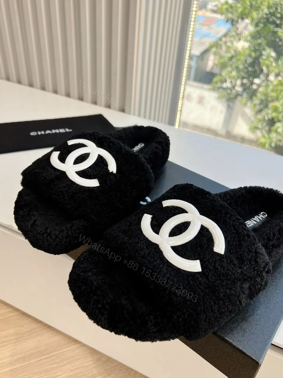 View 8 of Cozy Black Plush Slippers with Logo Detail