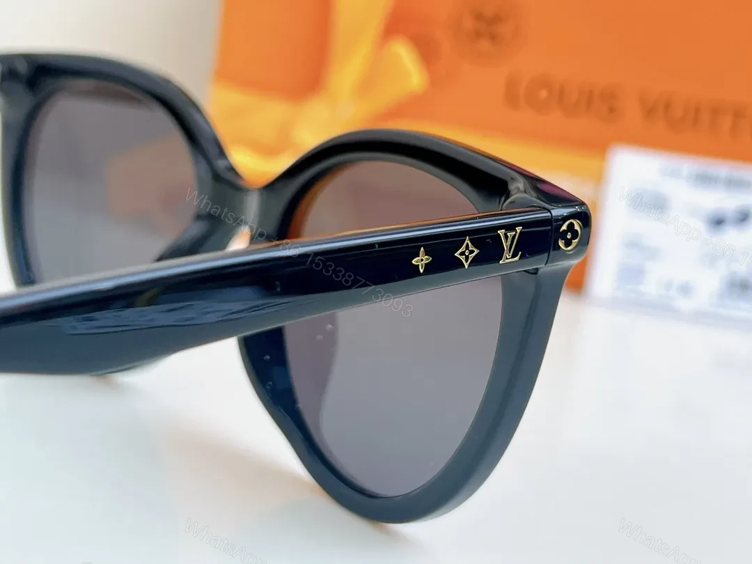 View 4 of Sleek Black Round-Frame Sunglasses with LV Accents