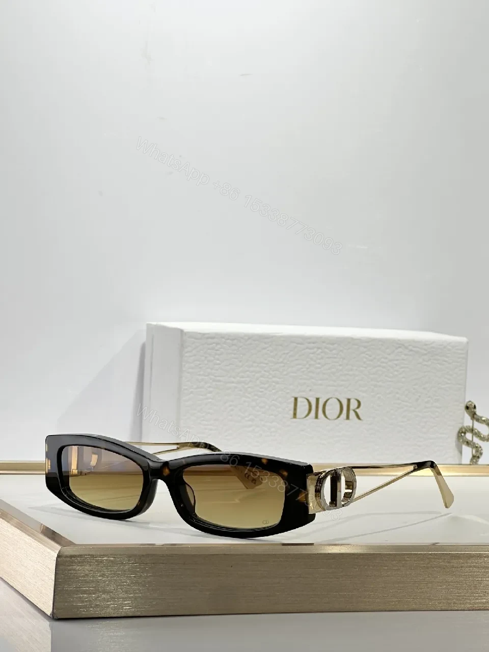 View 4 of White Rectangular Sunglasses with Dior-Gold Accents: Modern Luxury Sideways