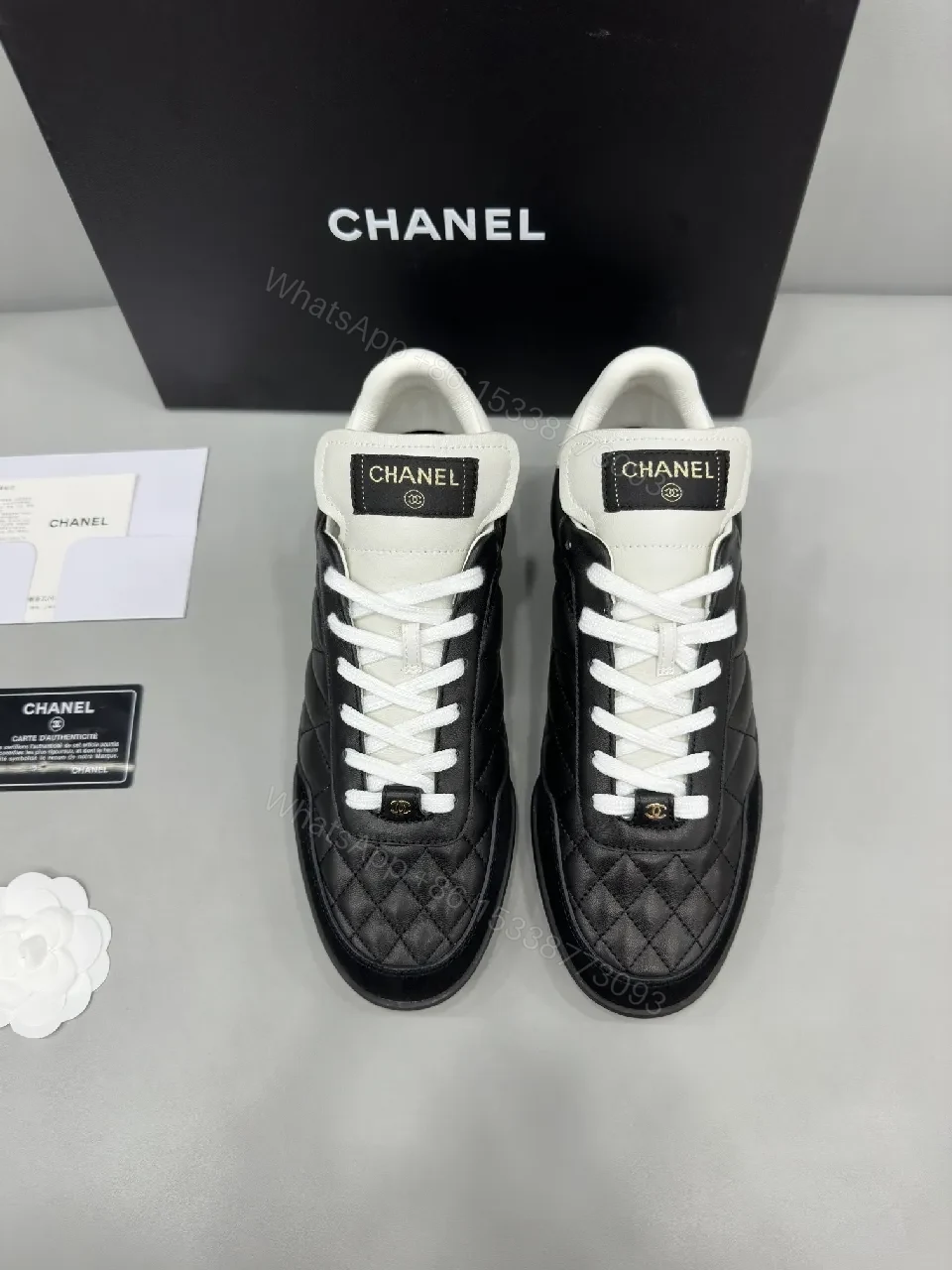 View 4 of Black-and-White Quilted Leather Sneakers with Luxe Hardware