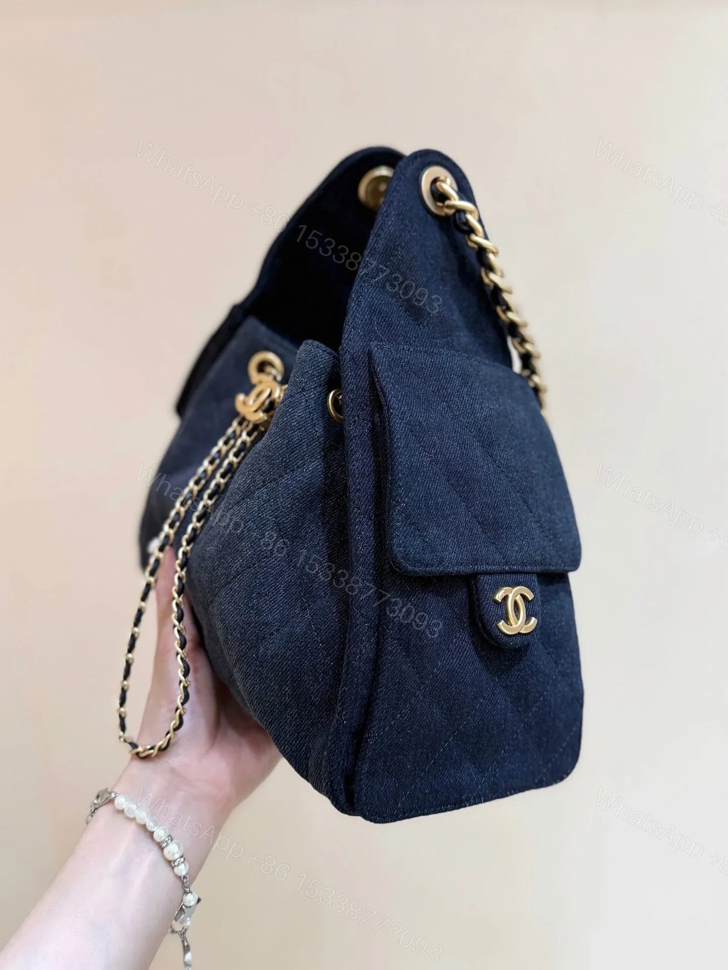 View 3 of CHANEL 25 HANDBAG 30 IN DENIM GOLD HARDWARE