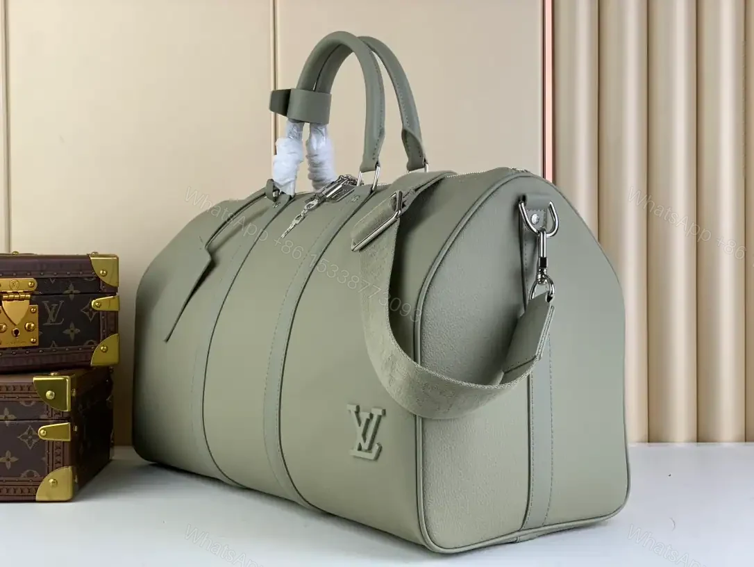 View 9 of LOUIS VUITTON KEEPALL BANDOULIÈRE 50 IN GREY – LBV424