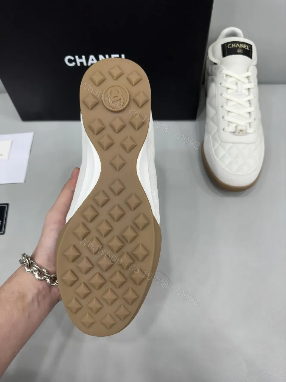 View 4 of White Quilted High-Top Leather Sneakers with Signature Details