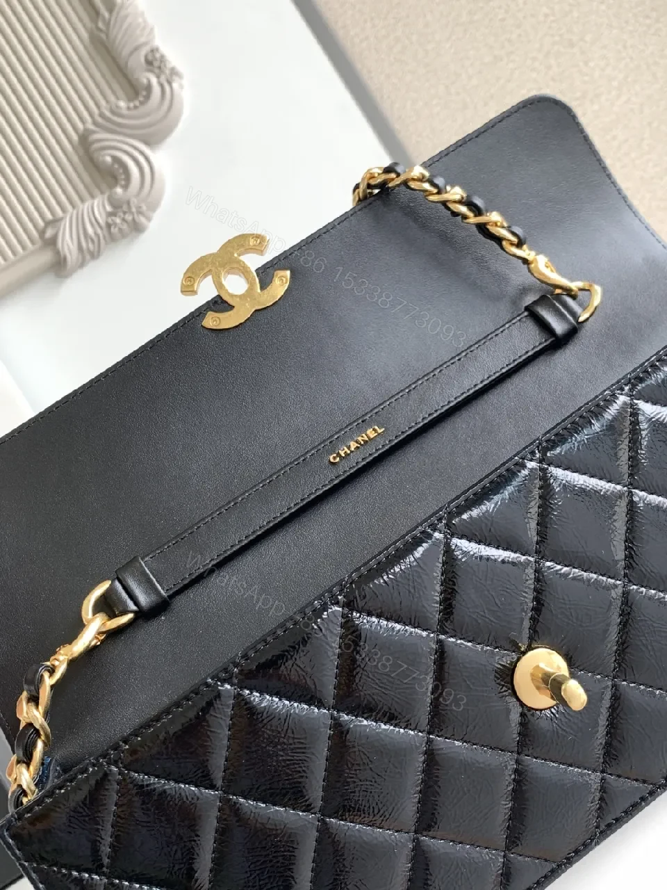 View 4 of Quilted Black Bag with Gold Hardware, Compact Shoulder Style