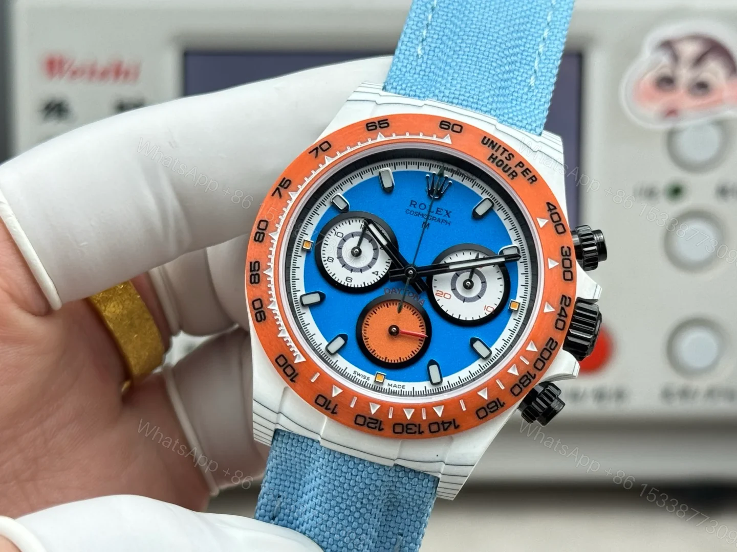 View 3 of Rolex Daytona Carbon Fiber Replica 40MM Exclusive Blue Dial Orange Bezel Fabric Strap R74 RG-ROLEX-DAYTONA