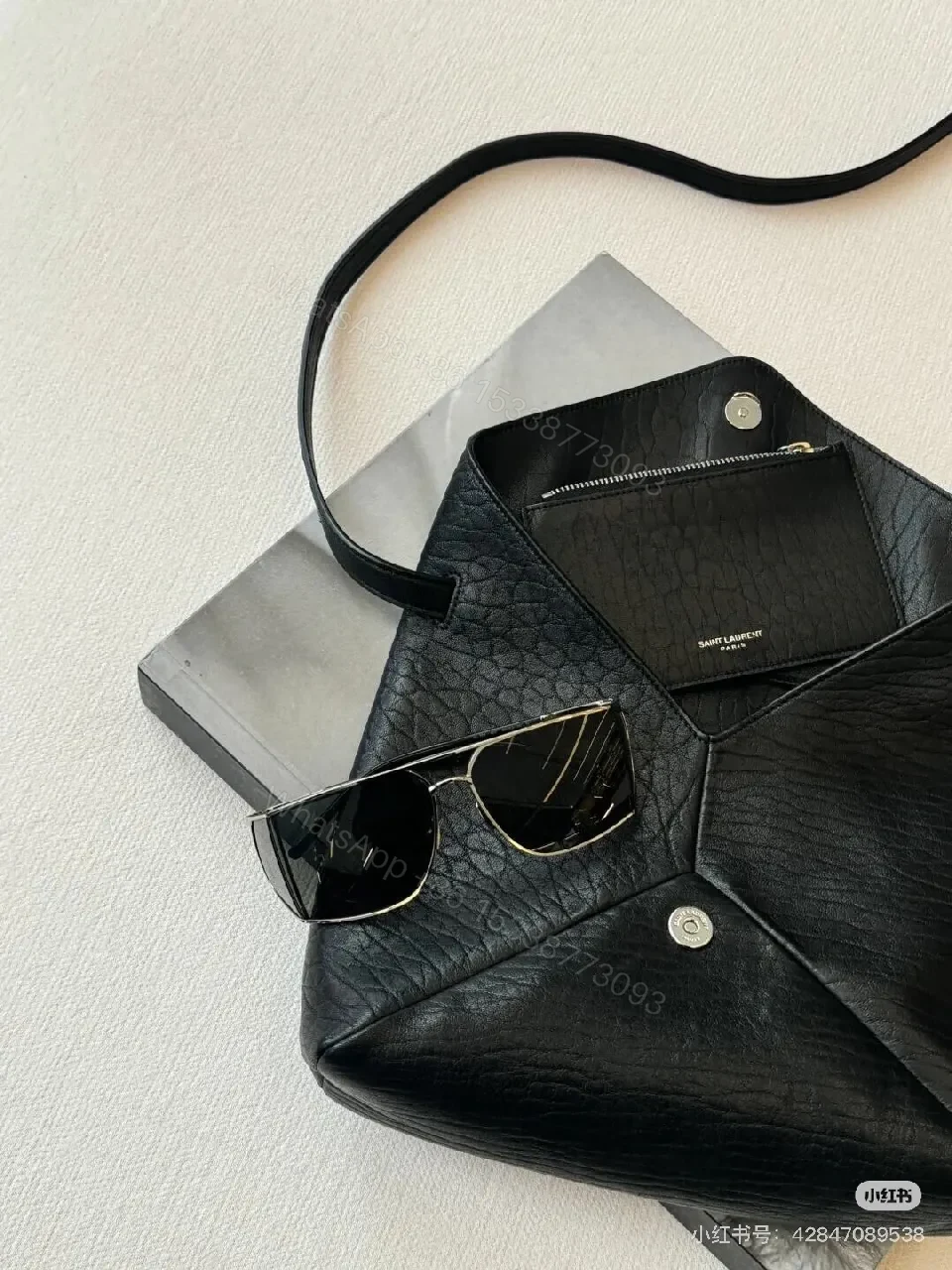 View 4 of Black Textured Leather Envelope Bag – Minimal Logo, Compact & Versatile