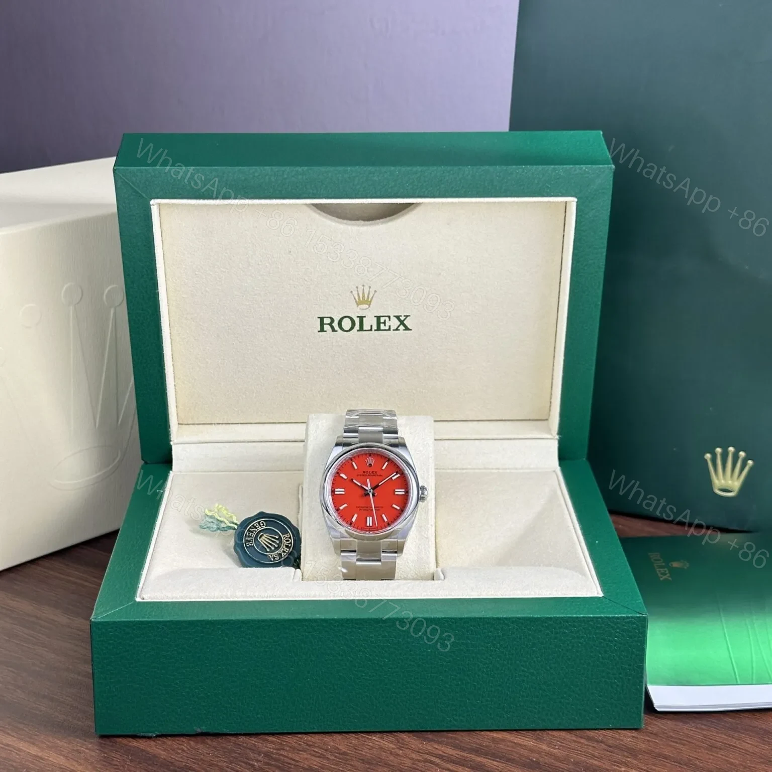 View 7 of Replica Rolex Oyster Perpetual Coral Red Dial 124300 41 mm