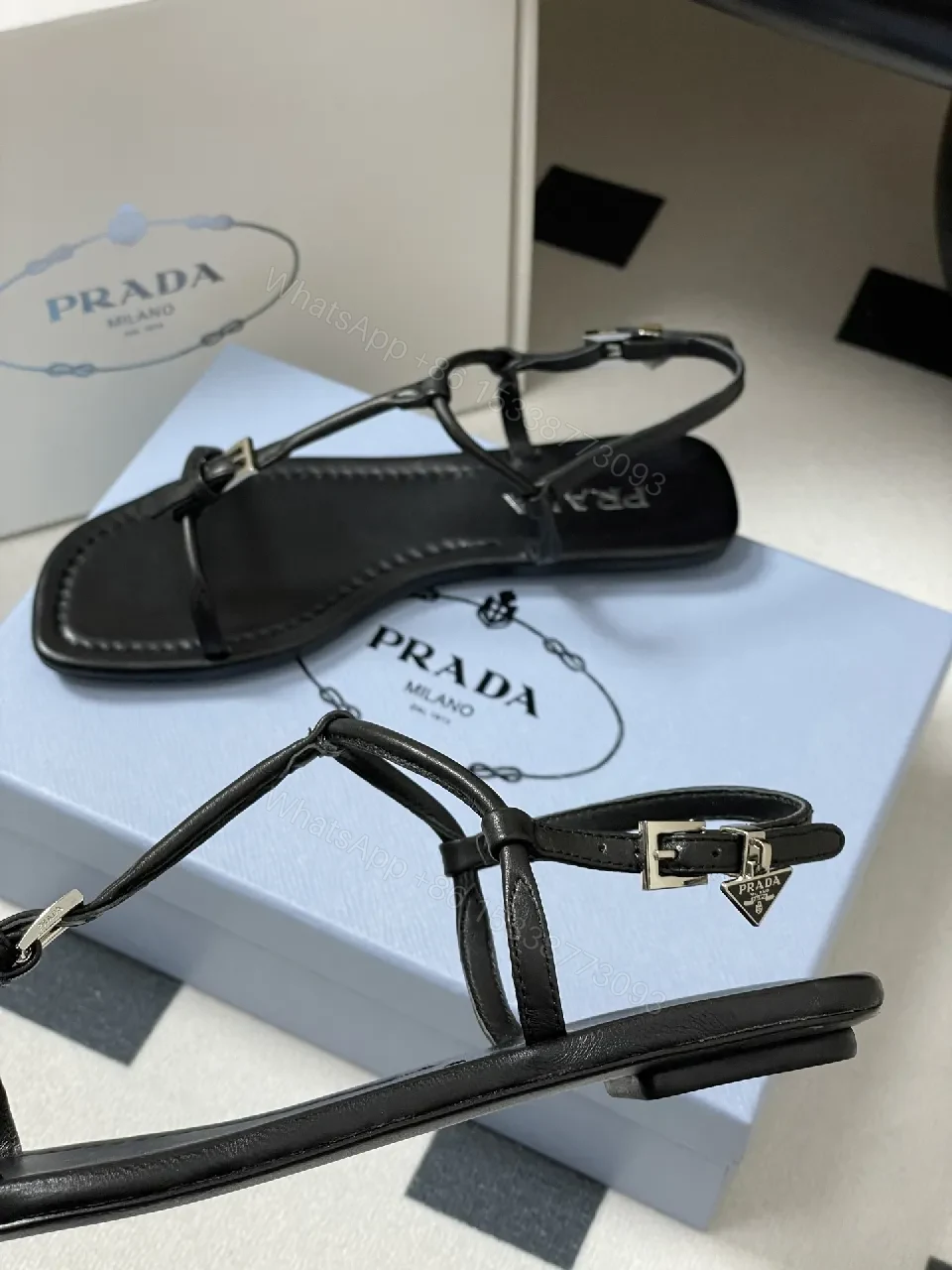 View 7 of Minimal Black Leather T-Strap Sandals with Padded Comfort