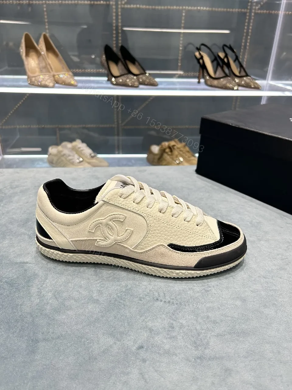 View 8 of Cream Leather Sneaker + Subtle Chanel-Inspired Detail + High-Top Comfort + Timeless Glossy Toe + Sneaker