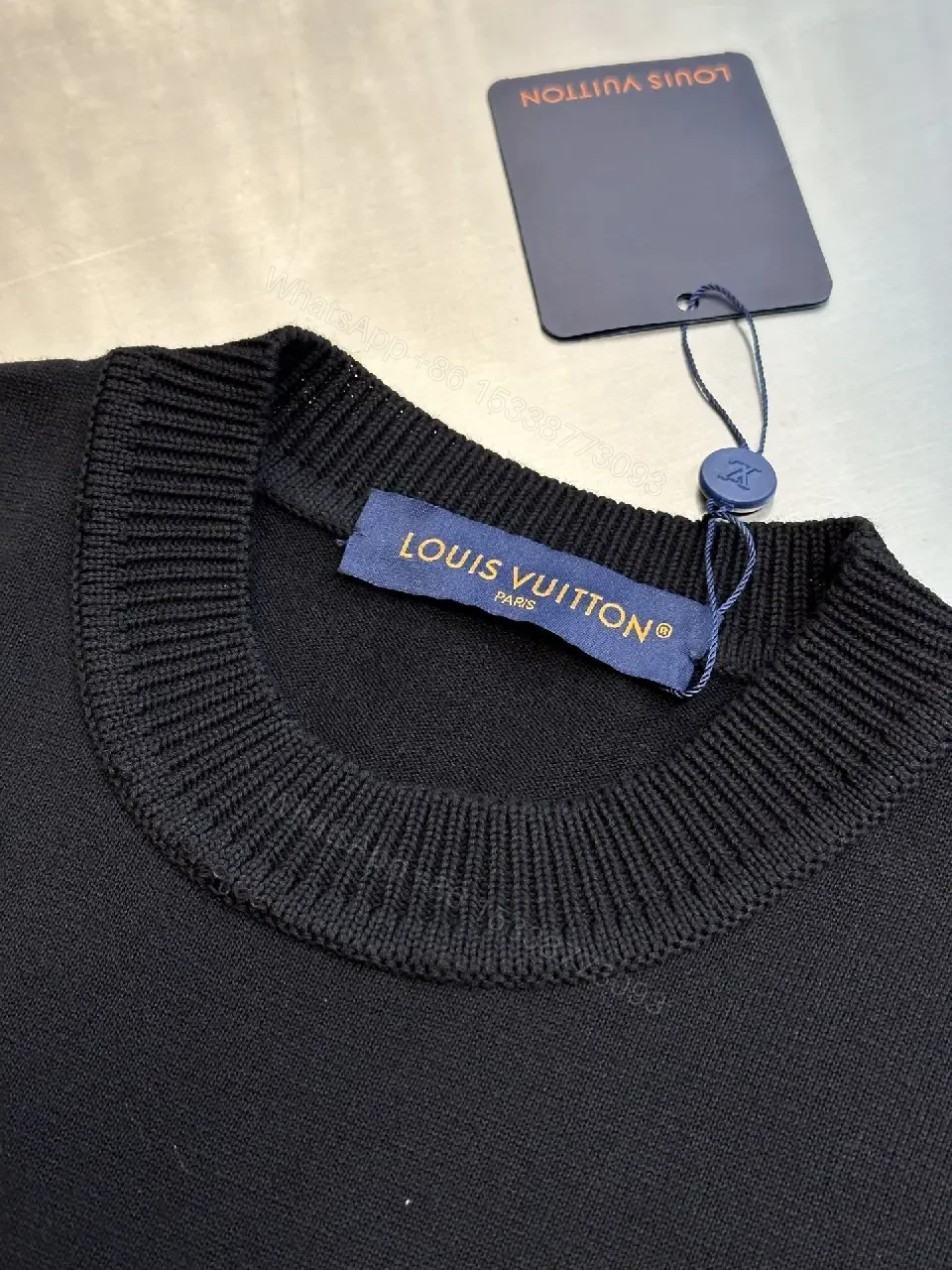 View 8 of Minimalist Black Crewneck Tee Dress – Subtle Logo, Versatile Dress