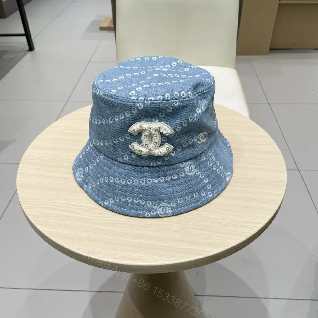 Denim-Threaded Bucket Hat with Emblem: Bold, All-Season Style — view 1