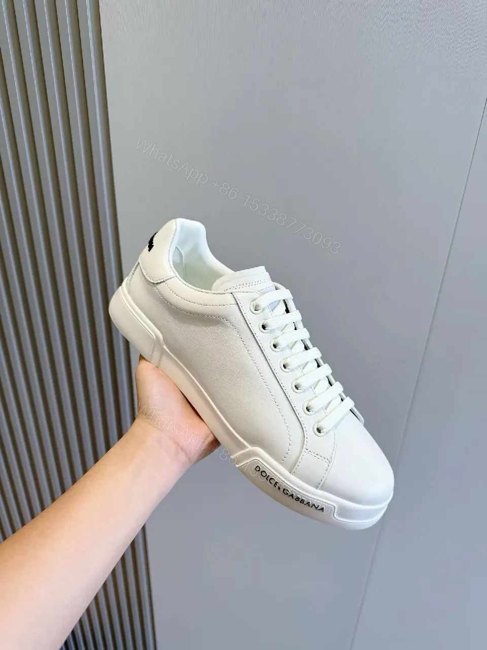 View 7 of Minimal White Leather Sneakers with Subtle Designer Detailing