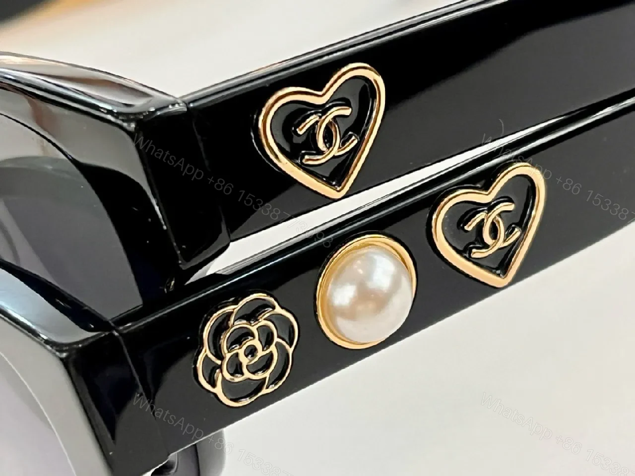 View 5 of Black Cat-Eye Sunglasses with Gold Heart Detail - Premium Acetate