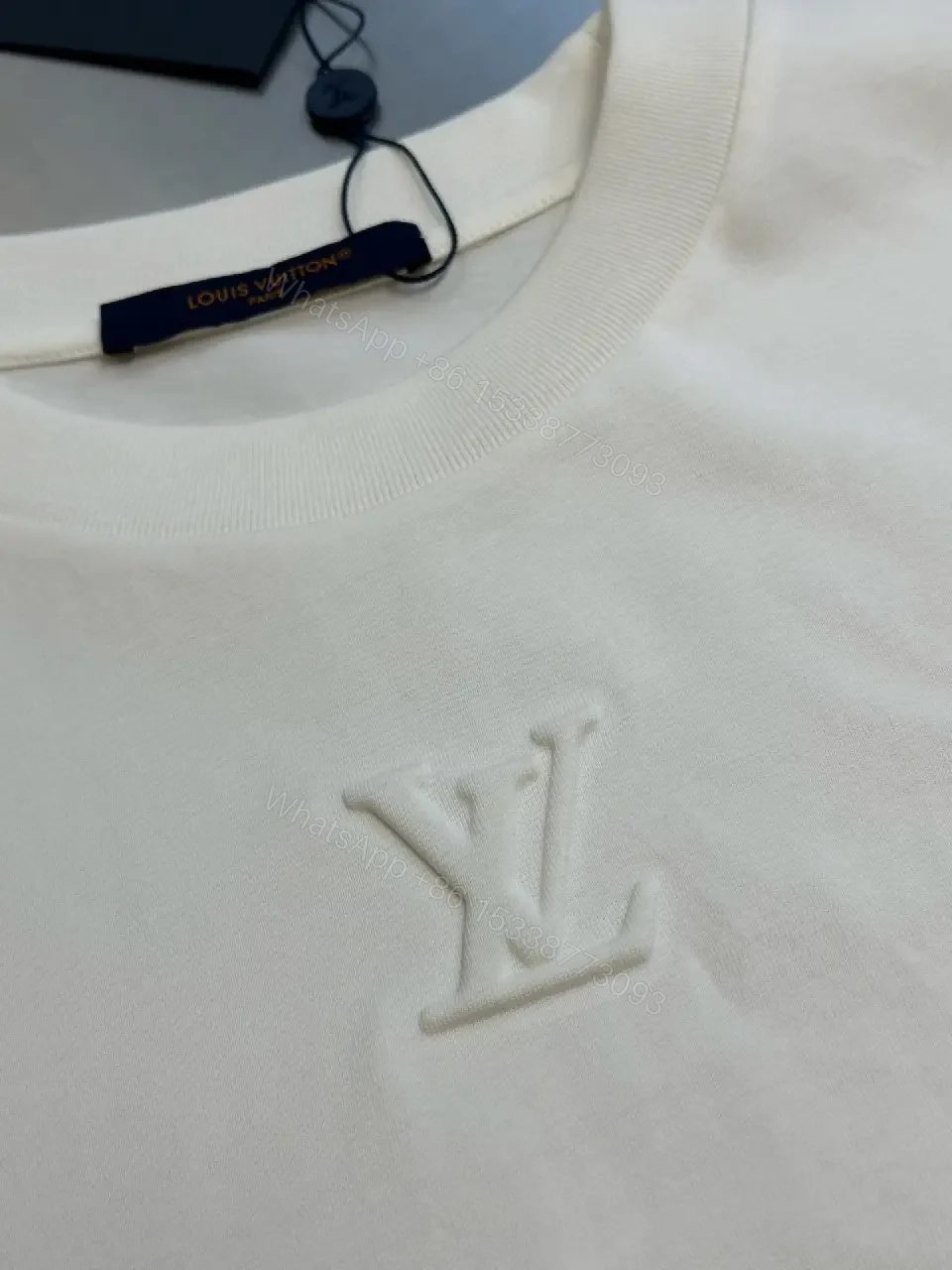 View 10 of Oversized White Tee with Subtle Embossed Logo - Minimal Luxury