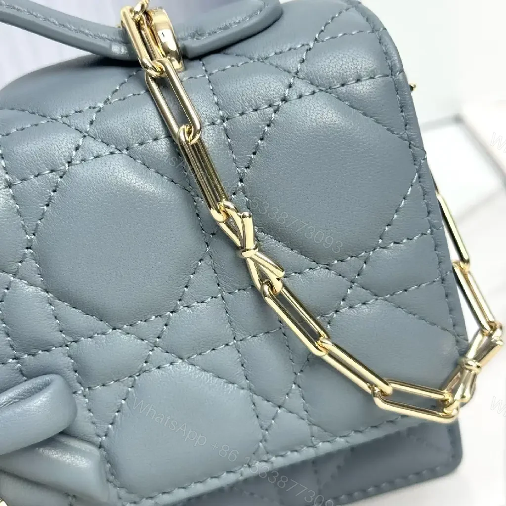 View 6 of Muted Blue-Gray Quilted Crossbody with Bow Charm, Luxe Everyday