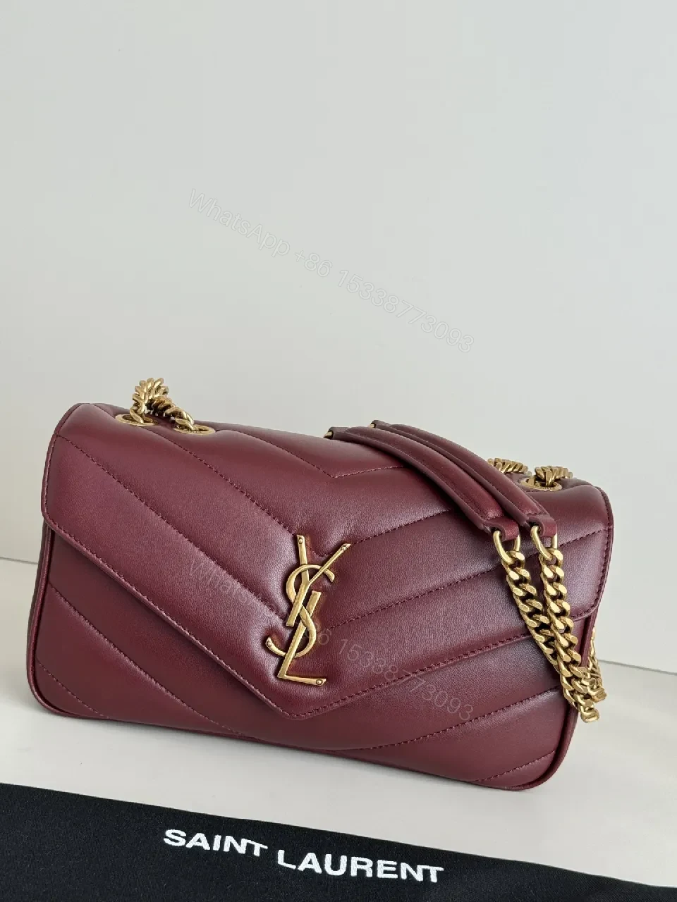 Burgundy Quilted Satchel with Gold Chain Detail — view 1