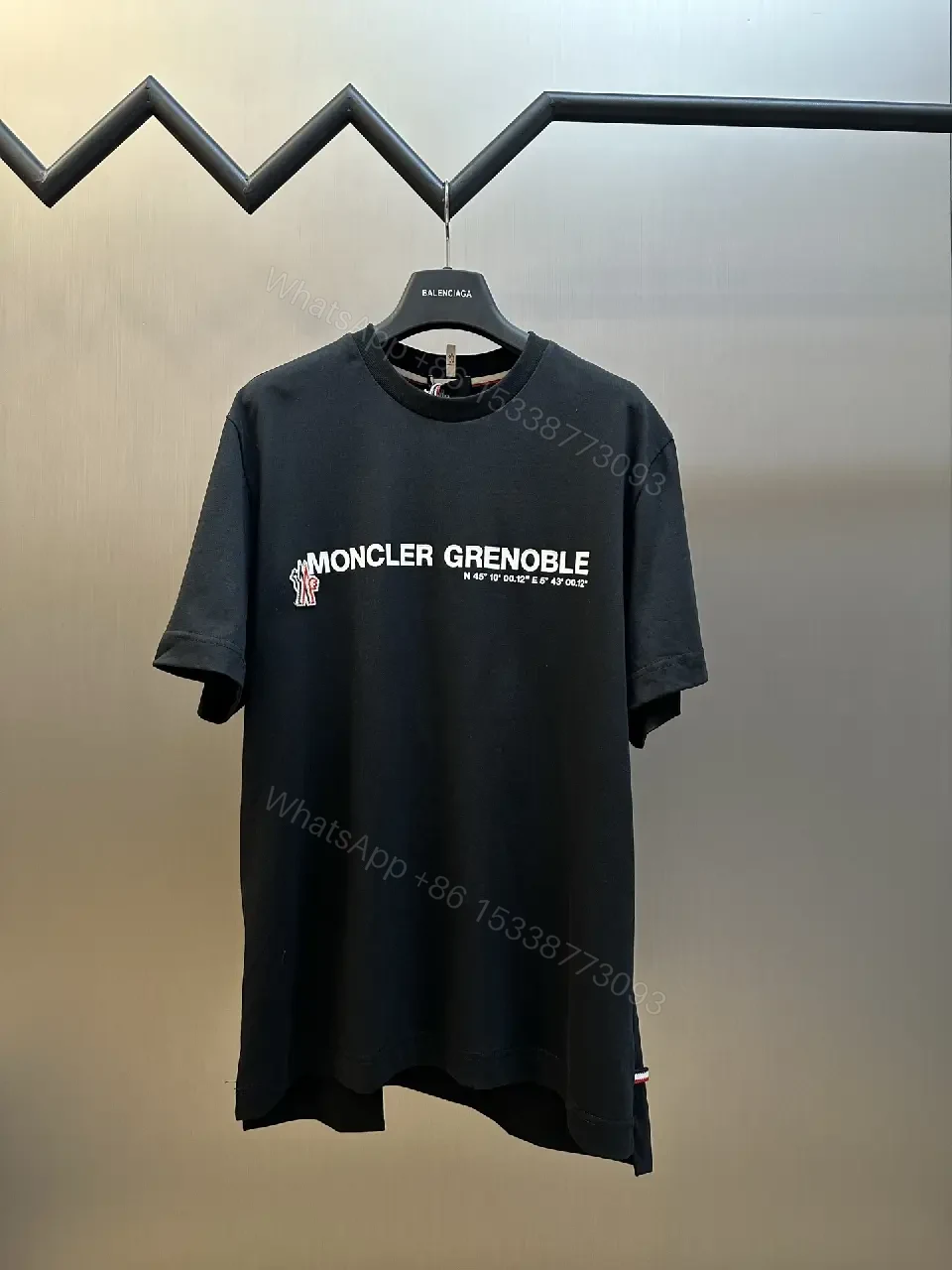 View 4 of Minimalist Black Tee with Logo Crest, Relaxed Fit, Premium Cotton