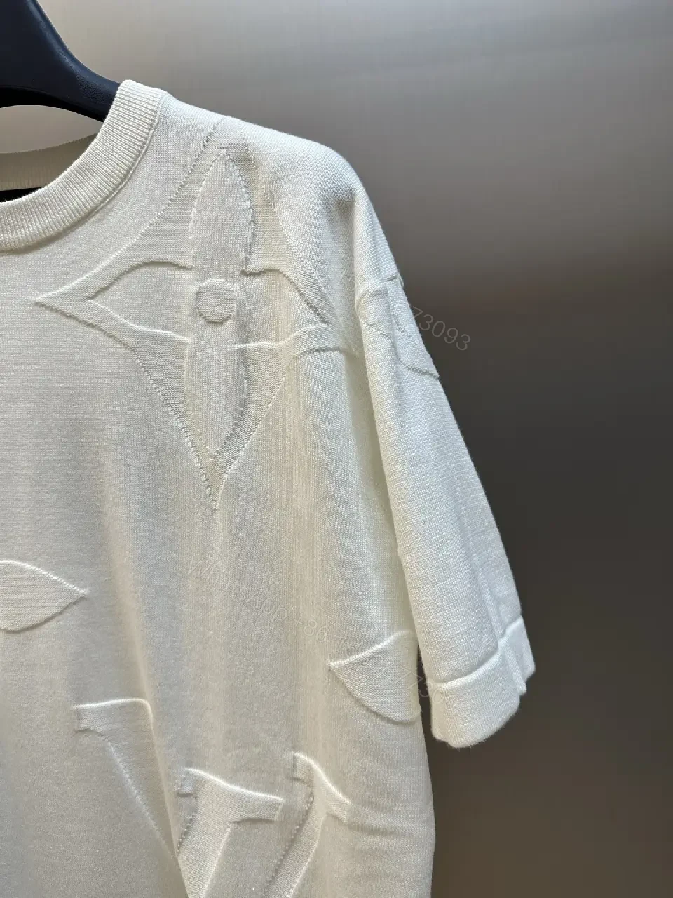 View 9 of Off-White Cream Oversized Tee with Embossed Logo Pattern
