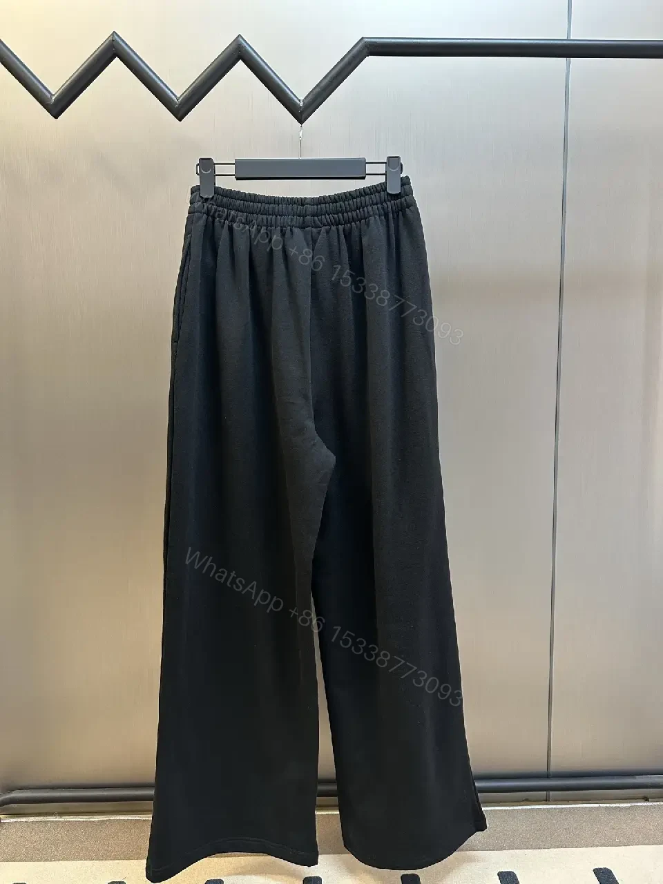 View 3 of Chic Black Wide-Leg Track Pants with Subtle Logo