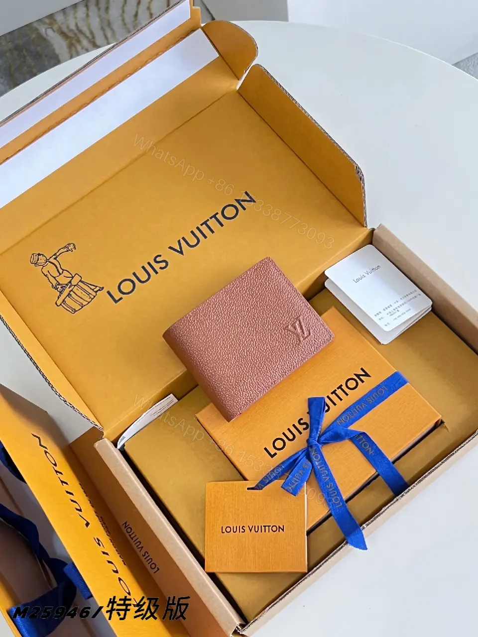 View 7 of Pink-Peach Pebbled Leather Bi-fold Wallet with LV Logo