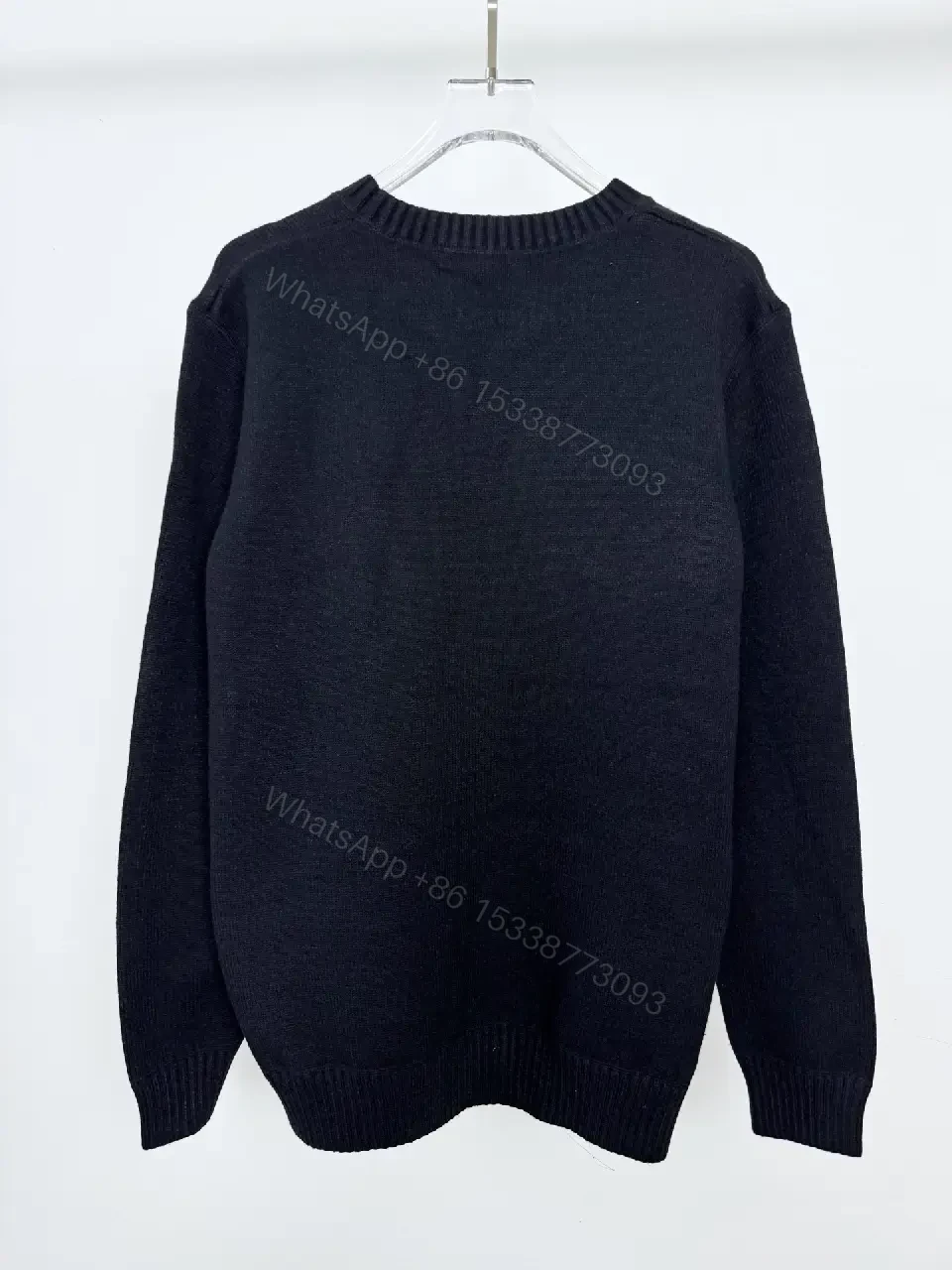 View 5 of Black Knit Pullover with Crest – Elevated Comfort Knitwear