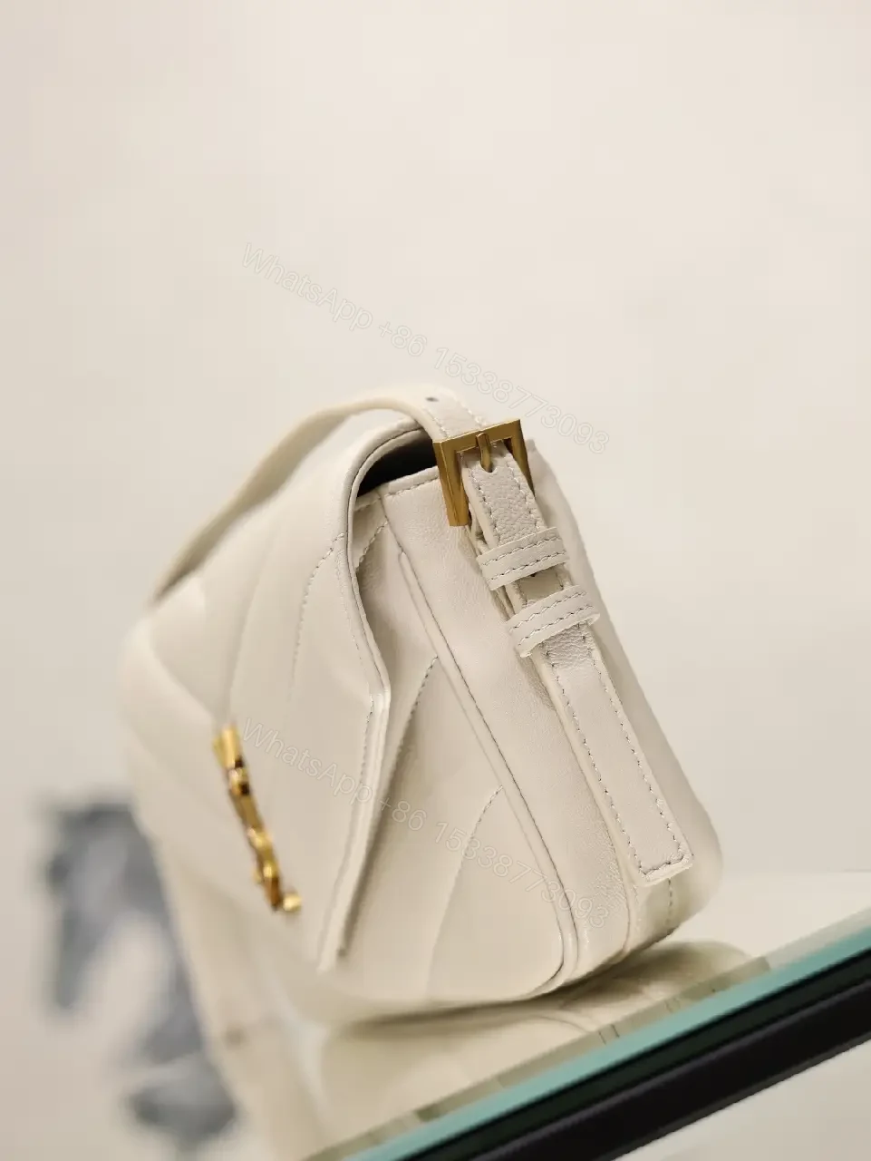 View 2 of Off-White Cream Leather Mini Crossbody Bag with Chevron Front Feature