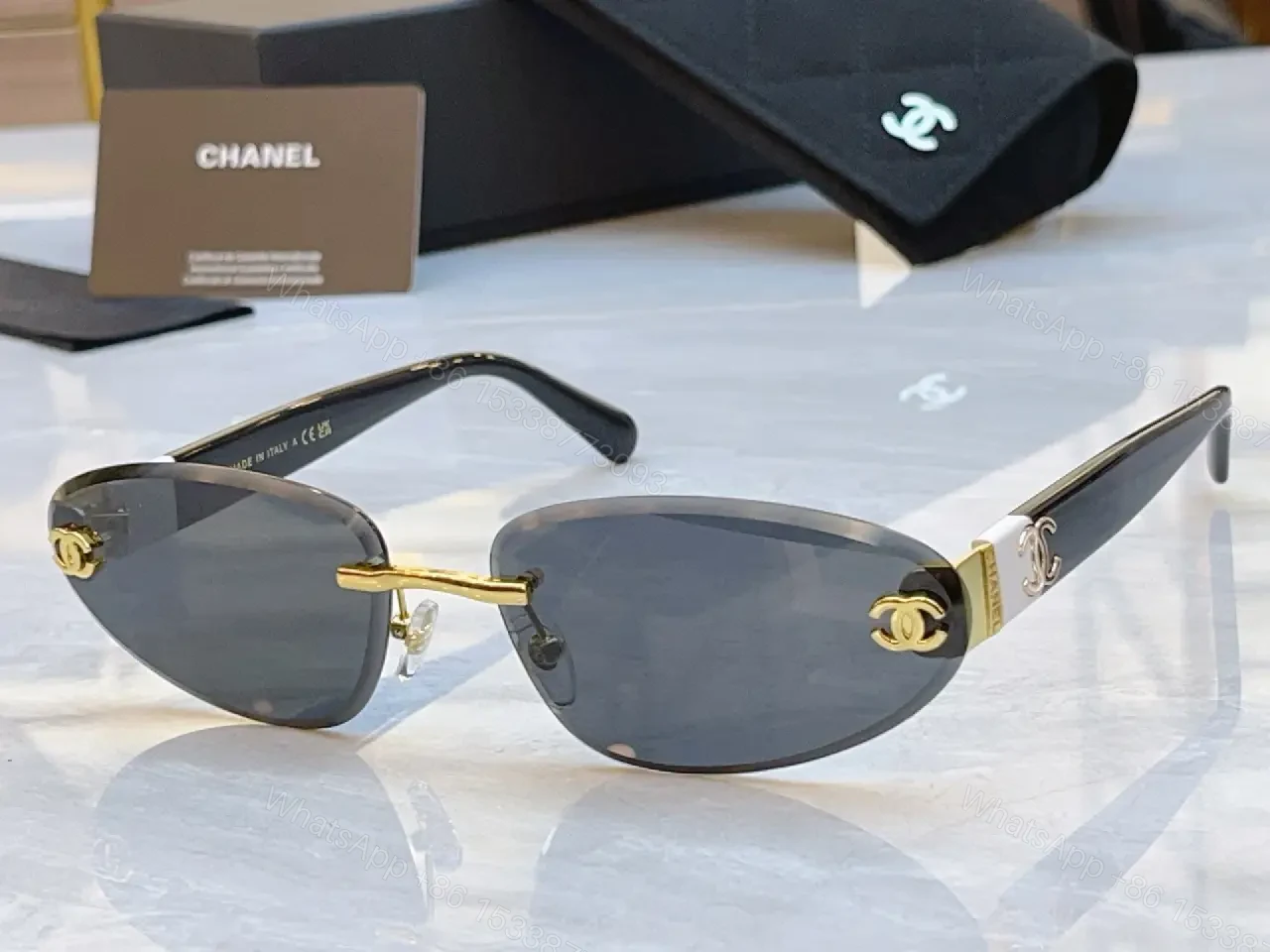 View 9 of Luxurious Silver-Gray Sunglasses: Gold Accents, Semi-Rimless Oval, Chanel Hardware