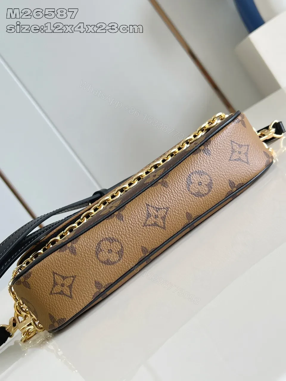 View 4 of Compact Dual-Tone Monogram Messenger: Subtle Luxury Bag
