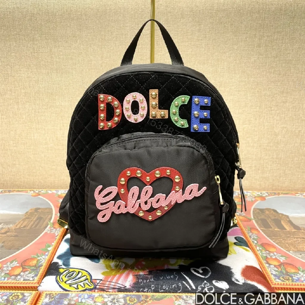 Black Quilted Backpack with Colorful Logo Embellishments, All-Day Comfort — view 1