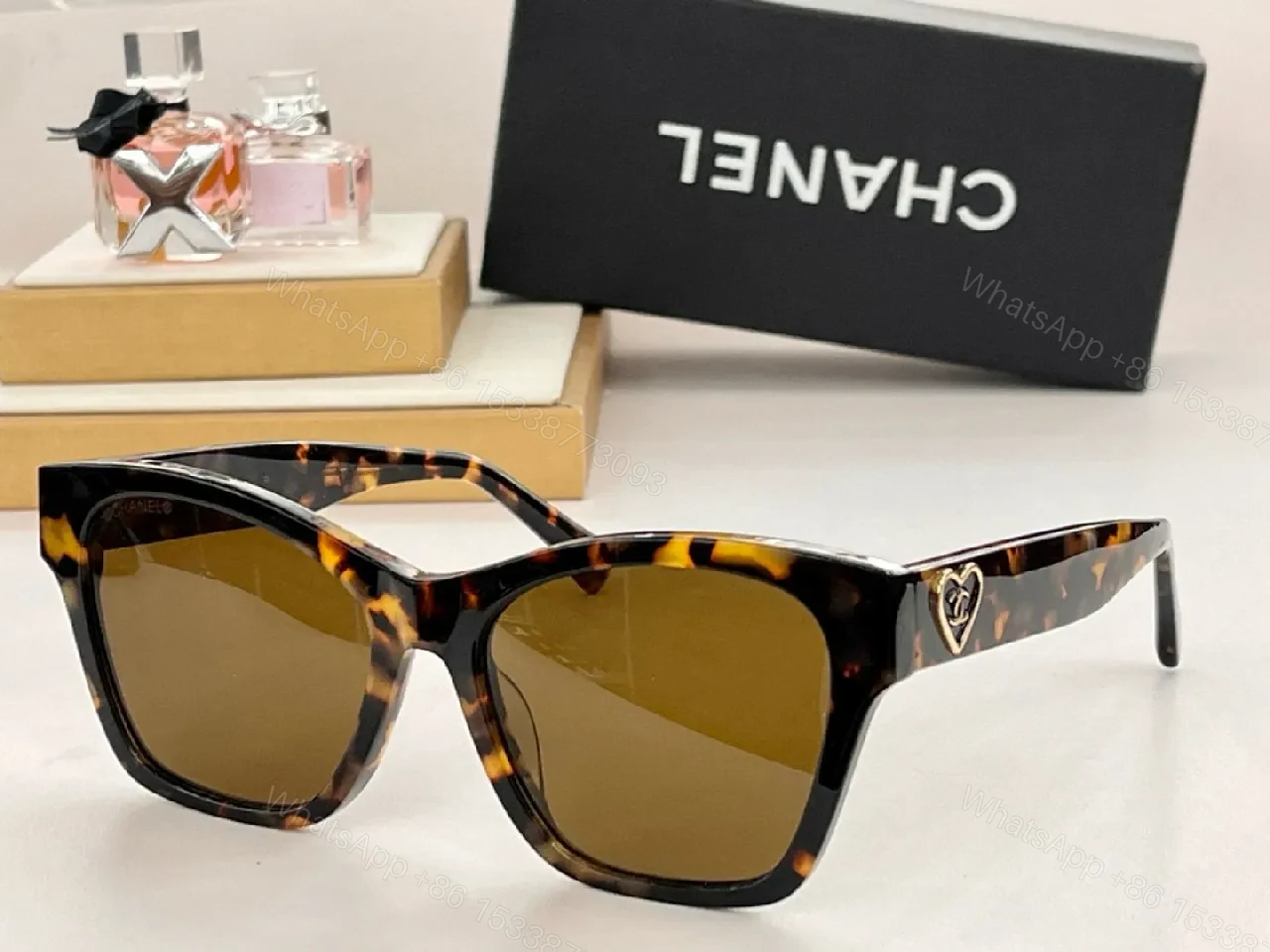 View 6 of Black Cat-Eye Sunglasses with Gold Heart Detail - Premium Acetate