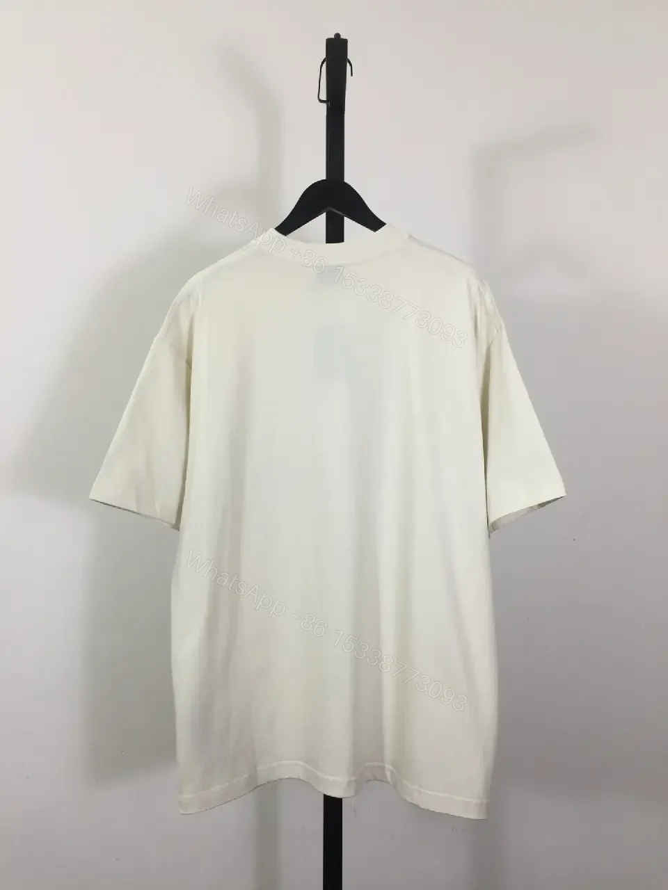 View 3 of Ivory Cotton Oversized Tee – Distressed Logo Streetwear Edge