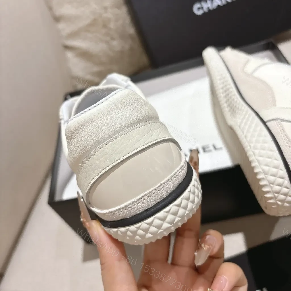 View 2 of Cream Leather-Texture Sneaker with Signature Emblem, Modern Couture Style