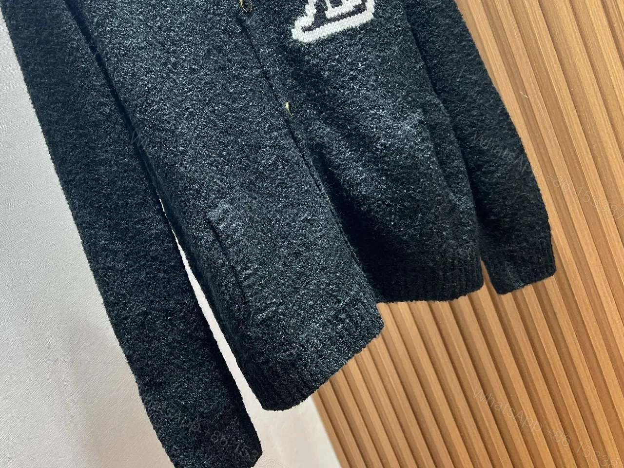 View 3 of Black Boucle Cardigan | Luxe Texture + Signature Logo + Cozy Warmth