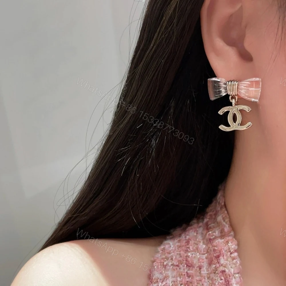 View 3 of CHANEL D25 CC BOW EARRINGS GOLD METAL ABF537 B19997 NAFVG